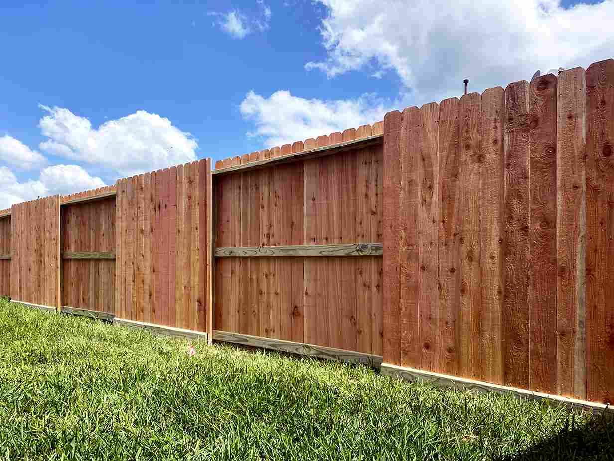 Alternating panel wood fence